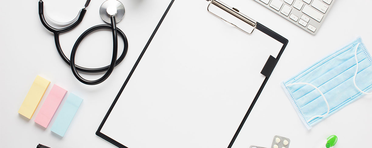 elevated-view-doctor-desk-clipboard