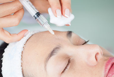 hand-injecting-syringe-woman-face