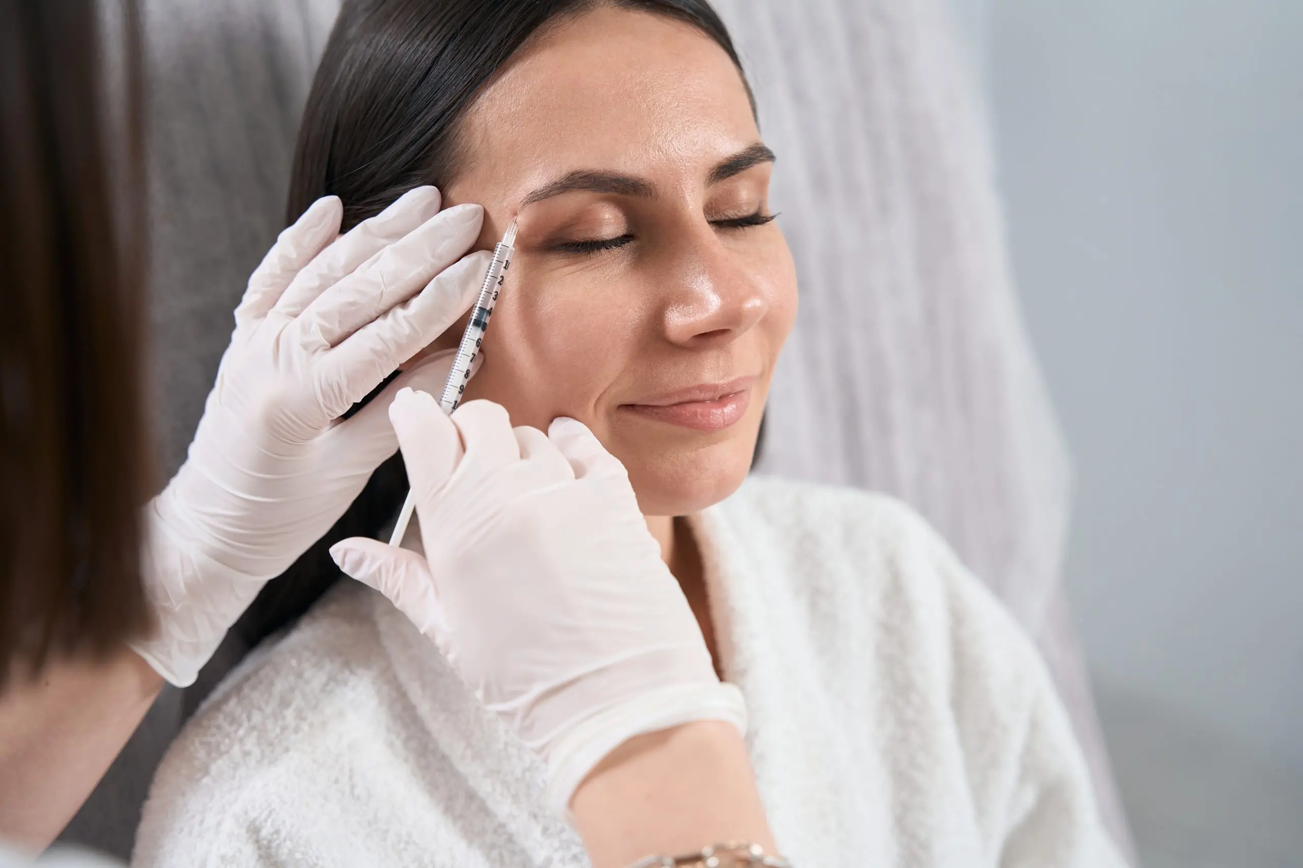 Beautiful lady on injection procedure, skin nutrition