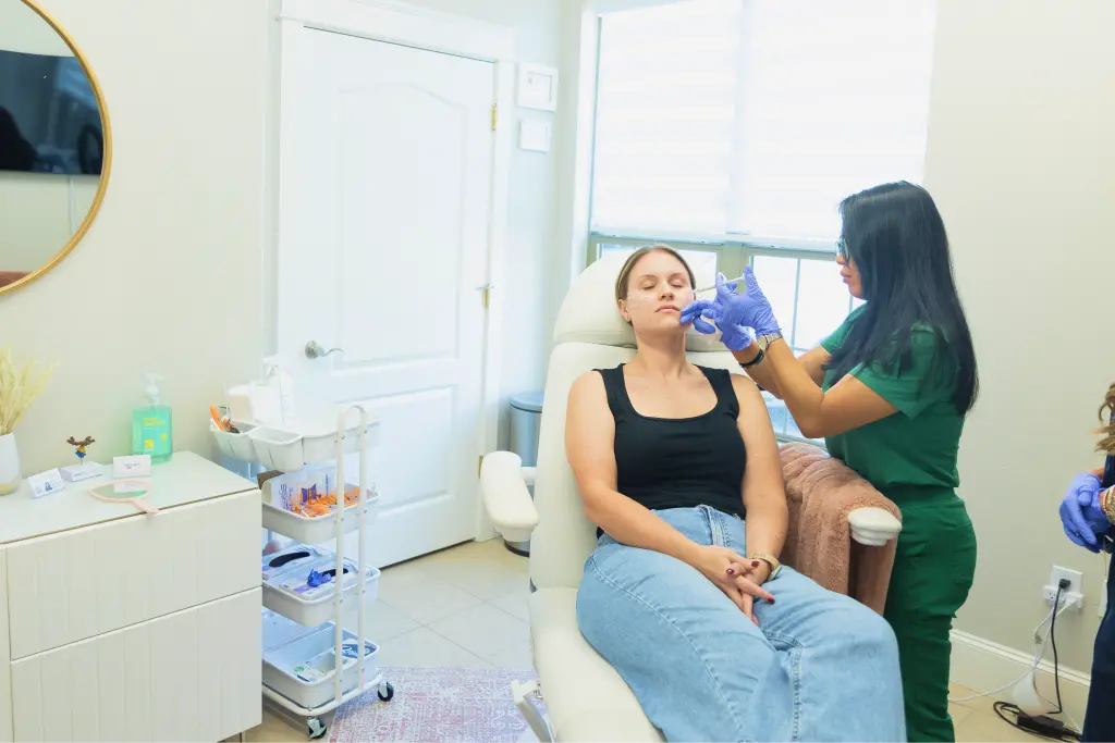 An ITA instructor demonstrating an injectable treatment during hands-on clinical training